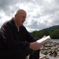 Tom reads at river Spey at Ballindalloch Estate