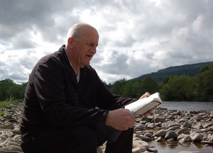 Tom reads at river Spey at Ballindalloch Estate